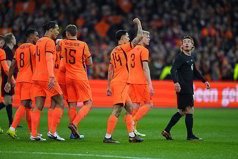 Netherlands' Tijjani Reijnders, centre right, celebrates with teammates after scoring his side's second goal during the international friendly soccer match between the Netherlands and Norway in Amsterdam, Netherlands.