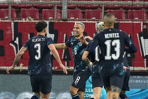 Paraguay's players celebrate after Paraguay's Diego Gomez, centre, scored his side's opening goal during the international friendly soccer match between Greece and Paraguay in Piraeus, Greece.