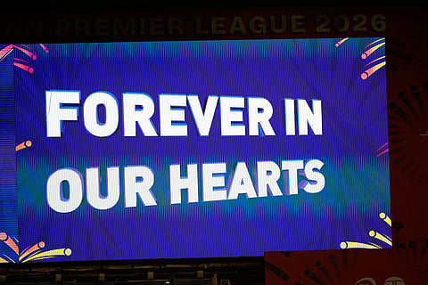 A signboard at M Chinnaswamy Stadium displays a tribute to 11 Royal Challengers Bengaluru fans who lost their lives in a stampede last year, as spectators wait for the Indian Premier League cricket match between Royal Challengers Bengaluru and Sunrisers Hyderabad to begin, in Bengaluru, India.