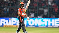 RCB Vs SRH, IPL 2026: Ishan Kishan Punishes Debutant Abhinandan Singh, Counters Pressure Of Early Collapse | Photo: AP/Aijaz Rahi : Sunrisers Hyderabad's captain Ishan Kishan celebrates his fifty runs during the Indian Premier League cricket match between Royal Challengers Bengaluru and Sunrisers Hyderabad in Bengaluru, India.