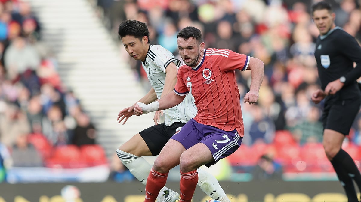 Scotland's John McGinn, right, challenges for the ball with Japan's Hiroki Ito during the international friendly soccer match between Scotland and Japan in Glasgow, Scotland, Saturday, March 28, 2026. -  (AP Photo/Scott Heppell)