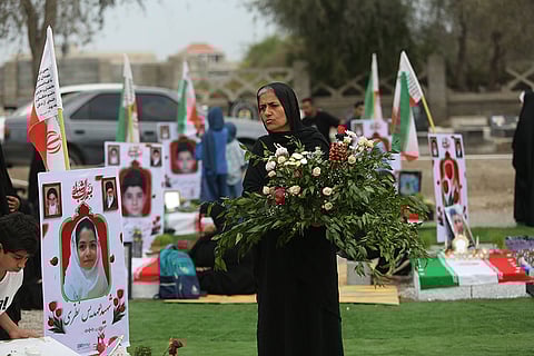 Iranians gather at a cemetery to commemorate victims, most of them children, who were killed in a US Israeli attack on a girls primary school in Minab, Hormozgan province, Iran.