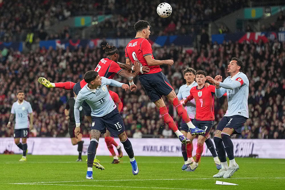 England's Dominic Solanke heads the ball during the international friendly soccer match between England and Uruguay in London. - | Photo: AP/Alastair Grant
