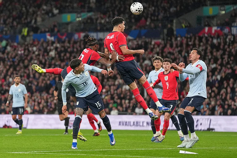 England's Dominic Solanke heads the ball during the international friendly soccer match between England and Uruguay in London. - | Photo: AP/Alastair Grant
