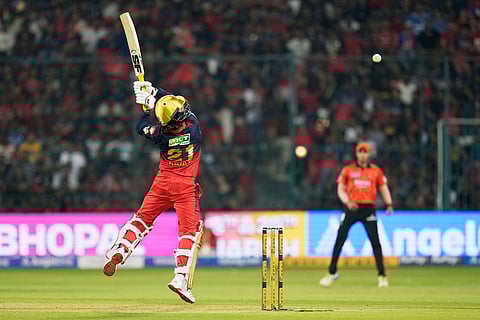 Royal Challengers Bengaluru's captain Rajat Patidar plays a shot during the Indian Premier League cricket match between Royal Challengers Bengaluru and Sunrisers Hyderabad in Bengaluru, India.