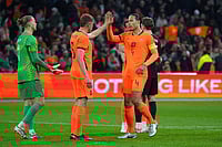 Netherlands 2-1 Norway, International Friendly: Van Dijk, Reijnders Seal Oranje Comeback Win | Photo: AP/Peter Dejong : Netherlands' Virgil van Dijk, centre right, and Natan Ake celebrate after the international friendly soccer match between the Netherlands and Norway in Amsterdam, Netherlands.