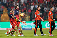 RCB Vs SRH, IPL 2026 In Pics: See Best Photos From Indian Premier League Match 1 At M Chinnaswamy Stadium | Photo: AP/Aijaz Rahi : Royal Challengers Bengaluru's Virat Kohli, left, gestures to the fans as he walks out with teammate Tim David after winning the Indian Premier League cricket match against Sunrisers Hyderabad in Bengaluru, India, Saturday, March 28, 2026. ()