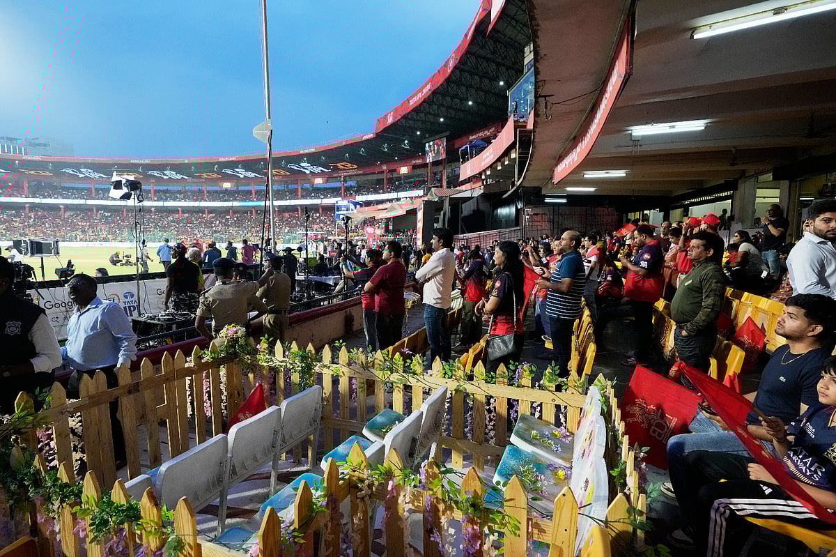 Eleven seats are kept at M Chinnaswamy Stadium as a tribute to 11 Royal Challengers Bengaluru fans who lost their lives in a stampede last year, as spectators wait for the Indian Premier League cricket match between Royal Challengers Bengaluru and Sunrisers Hyderabad to begin, in Bengaluru, India, Saturday, March 28, 2026. 