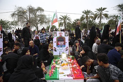 Iranians gather at a cemetery to commemorate victims, most of them children, who were killed in a US Israeli attack on a girls primary school in Minab, Hormozgan province, Iran.