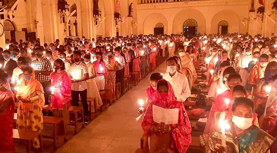Congregation holding candles during Easter church service