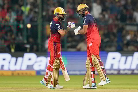 Royal Challengers Bengaluru's Devdutt Padikkal, right, is congratulated by batting partner Virat Kohli for playing a shot during the Indian Premier League cricket match between Royal Challengers Bengaluru and Sunrisers Hyderabad in Bengaluru, India, Saturday, March 28, 2026. ()
