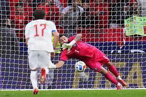 Ecuador's goalkeeper Hernan Galindez saves a penalty kick during a friendly soccer match between Morocco and Ecuador in Madrid, Spain.