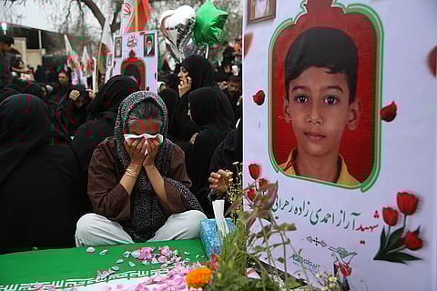 Iranians gather at a cemetery to commemorate victims, most of them children, who were killed in a US Israeli attack on a girls primary school in Minab, Hormozgan province, Iran.