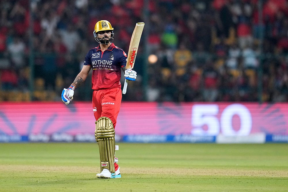 Virat Kohli celebrates his fifty runs