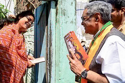 BJP candidate Swapan Dasgupta campaigns for the Rashbehari Assembly constituency ahead of the state Assembly elections, in Kolkata, West Bengal.