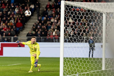 Switzerland's goalkeeper Gregor Kobel watches the ball go into the net for Germany's fourth goal during an international friendly soccer match between Switzerland and Germany in Basel, Switzerland.