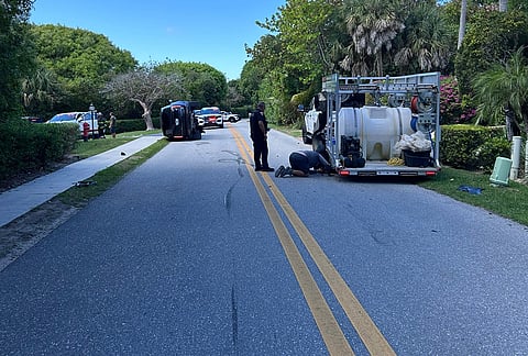 This photo provided by the Martin County Sheriff's Office shows skid marks near the overturned vehicle in a rollover crash which involved Tiger Woods in Jupiter Island, Florida.
