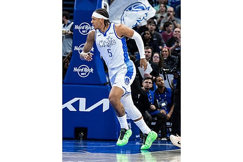 Orlando Magic forward Paolo Banchero runs upcourt during the first half of an NBA basketball game against the Sacramento Kings in Orlando, Fla.
