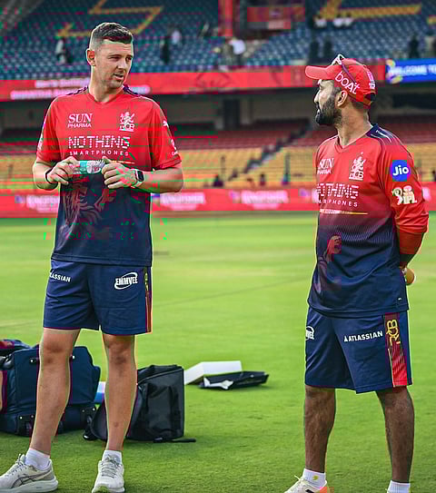 Josh Hazlewood continuing his rehab with Dinesh Karthik in the RCB camp ahead of IPL 2026. 