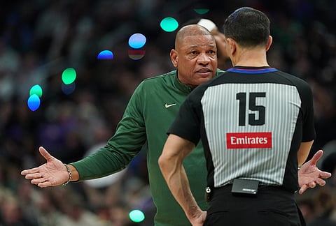 Milwaukee Bucks head coach Doc Rivers reacts as he talks with an official during the first half of an NBA basketball game against the San Antonio Spurs, in Milwaukee. 