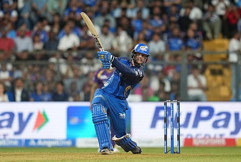 Mumbai Indians' Ryan Rickelton plays a shot during the Indian Premier League cricket match between Mumbai Indians and Kolkata Knight Riders in Mumbai.