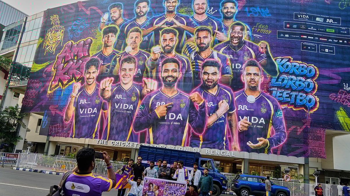 Supporters of Kolkata Knight Riders cheer in front of the facade of the Eden Gardens stadium ahead of their Indian Premier League cricket match against Mumbai Indians in Mumbai, India, Sunday, March 29, 2026. - (AP Photo/Bikas Das)