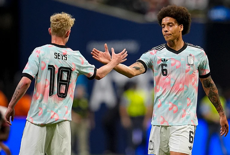 Belgium's Joaquin Seys (18) and Axel Witsel celebrate after defeating the United States in an international friendly soccer match in Atlanta. - | Photo: AP/Mike Stewart