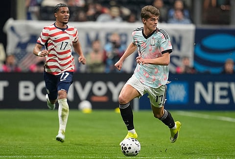 Belgium's Charles De Ketelaere (17) dribbles ahead of United States' Malik Tillman (17) during an international friendly soccer match, in Atlanta.