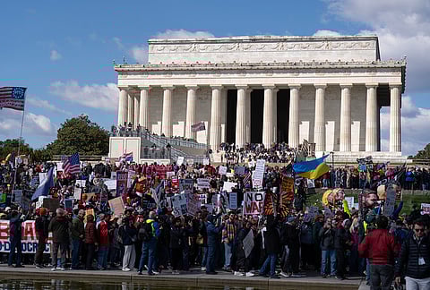 Demonstrators rally in front of the Lincoln Memorial during a "No Kings" protest in Washington.