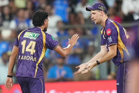 Kolkata Knight Riders' Vaibhav Arora, left, celebrates the wicket of Mumbai Indians' Rohit Sharma during the Indian Premier League cricket match between Mumbai Indians and Kolkata Knight Riders in Mumbai.