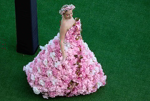 A racegoer arrives at the Meydan Racecourse ahead of the Dubai World Cup, United Arab Emirates.