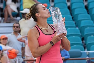 | Photo: AP/Marta Lavandier : Aryna Sabalenka kisses the trophy after winning the women's singles final at the Miami Open tennis tournament in Miami Gardens, Florida.