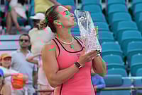 Sabalenka Defeats Gauff To Lift Miami Open 2026 Title | Photo: AP/Marta Lavandier : Aryna Sabalenka kisses the trophy after winning the women's singles final at the Miami Open tennis tournament in Miami Gardens, Florida.