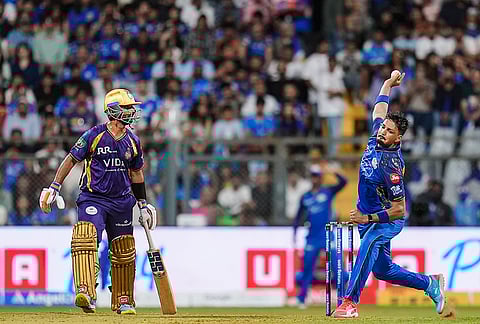 Mumbai Indians' Allah Ghazanfar bowls a delivery during an Indian Premier League (IPL) 2026 T20 cricket match between Mumbai Indians and Kolkata Knight Riders, at the Wankhede Stadium, in Mumbai, Maharashtra.