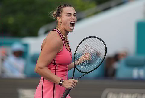 Aryna Sabalenka reacts after winning a point against Coco Gauff during the women's singles final at the Miami Open tennis tournament, in Miami Gardens, Florida.