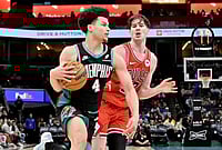 | Photo: AP/Brandon Dill : Memphis Grizzlies guard Walter Clayton Jr. (4) drives against Chicago Bulls center Lachlan Olbrich (47) in the second half of an NBA basketball game in Memphis, Tennessee. 