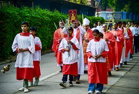Christians take part in a procession at the St. Joseph's Cathedral Church on the occassion of Palm Sunday, in Prayagraj, Uttar Pradesh. Palm Sunday marks the beginning of Holy Week and commemorates the entry of Jesus Christ into Jerusalem. 