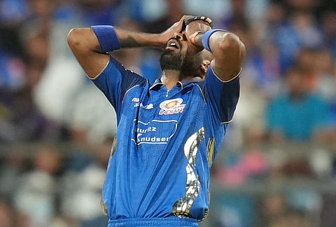 Mumbai Indians' captain Hardik Pandya reacts after bowls a delivery during the Indian Premier League cricket match between Mumbai Indians and Kolkata Knight Riders in Mumbai.