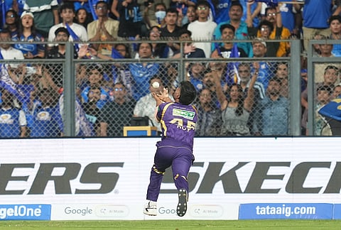 Kolkata Knight Riders' Anukul Roy takes the catch to dismiss Mumbai Indians' Rohit Sharma during the Indian Premier League cricket match between Mumbai Indians and Kolkata Knight Riders in Mumbai.