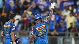 (AP Photo/Rafiq Maqbool) : Mumbai Indians' captain Hardik Pandya, right, and Naman Dhir celebrate after won the match during the Indian Premier League cricket match between Mumbai Indians and Kolkata Knight Riders in Mumbai, India, Sunday, March 29, 2026.