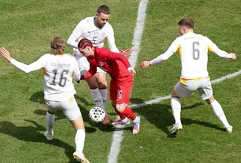 Canada's Marcelo Flores tries to find a path through Iceland's defense during the second half of an international friendly soccer match in Toronto.