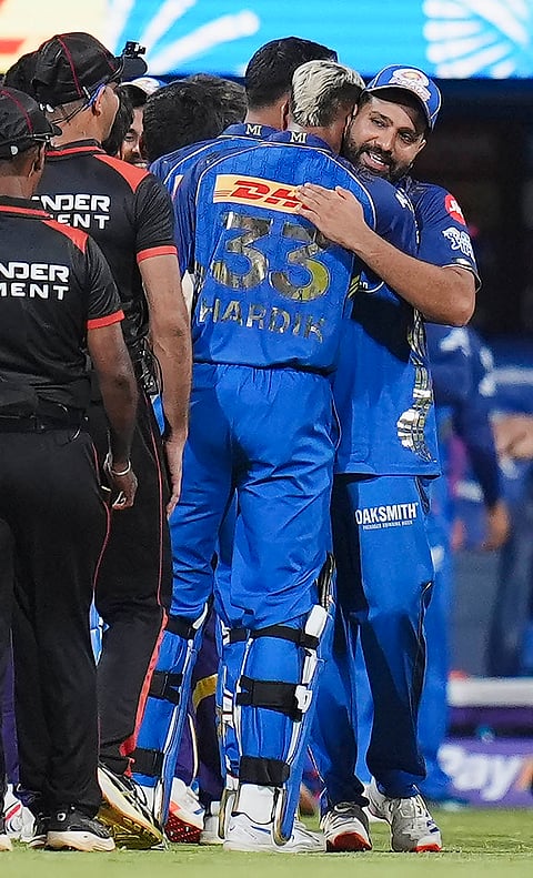 Mumbai Indians' captain Hardik Pandya being congratulated by Rohit Sharma after winning an Indian Premier League (IPL) 2026 T20 cricket match between Mumbai Indians and Kolkata Knight Riders, at the Wankhede Stadium, in Mumbai, Maharashtra.