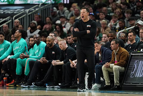 San Antonio Spurs head coach Mitch Johnson yells during the second half of an NBA basketball game against the Milwaukee Bucks in Milwaukee.