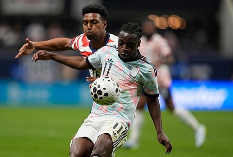 Belgium's Jeremy Doku (16) shields the ball from the United States' Alexander Freeman (16) during the second half of an international friendly soccer match, in Atlanta.