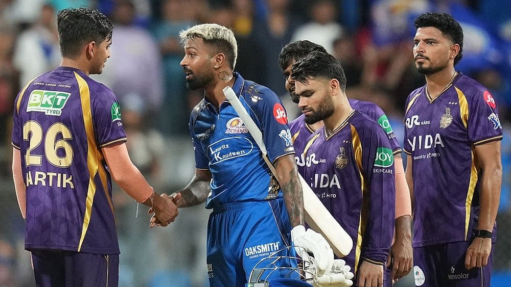 | Photo: AP/Rafiq Maqbool : Mumbai Indians' captain Hardik Pandya, second left, shake hands with Kolkata Knight Riders' Kartik Tyagi after won the match during the Indian Premier League cricket match between Mumbai Indians and Kolkata Knight Riders in Mumbai.