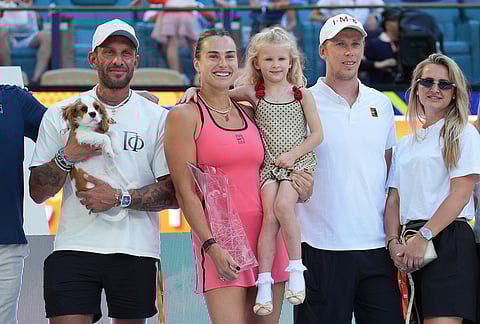 Aryna Sabalenka poses with her goddaughter, family and her fiancee Georgios Frangulis, left, after winning the women's singles final at the Miami Open tennis tournament in Miami Gardens Florida.
