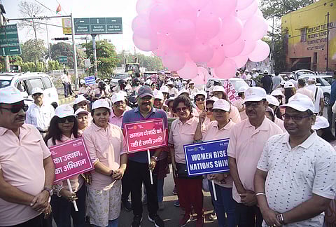 Bihar Rural Works Department Minister Ashok Choudhary and others participate in a walkathon to mark women empowerment, in Patna, Bihar.