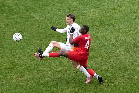 Canada's Kamal Miller (4) clears the ball from Iceland's Brynjofur Willumsson Willumsson during the second half  during the second half of an international friendly soccer match in Toronto.