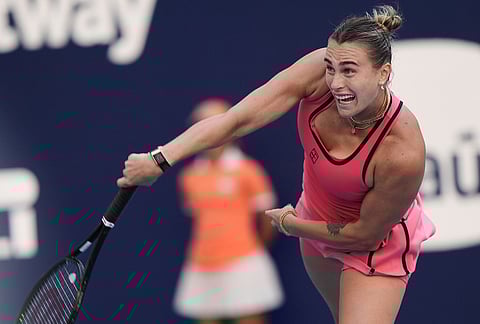 Aryna Sabalenka serves to Coco Gauff during the women's singles final at the Miami Open tennis tournament, in Miami Gardens, Florida.