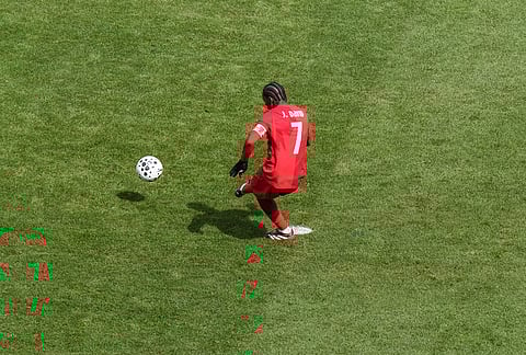 Canada's Jonathan David scores his second penalty to tie the score against Iceland during an international friendly soccer match in Toronto.